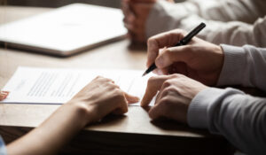 a client signing into a new franchise contract