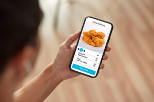 a man using his phone for food delivery