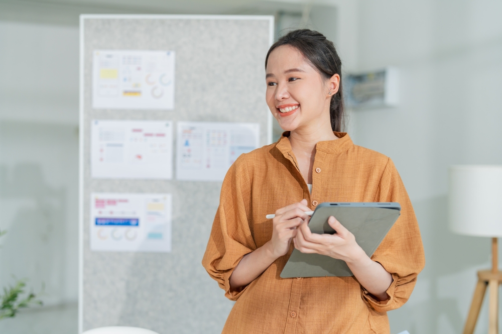 a business owner holding a tablet