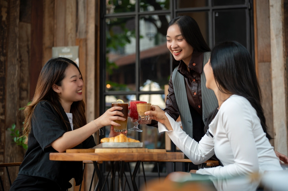 three professional women having a drink